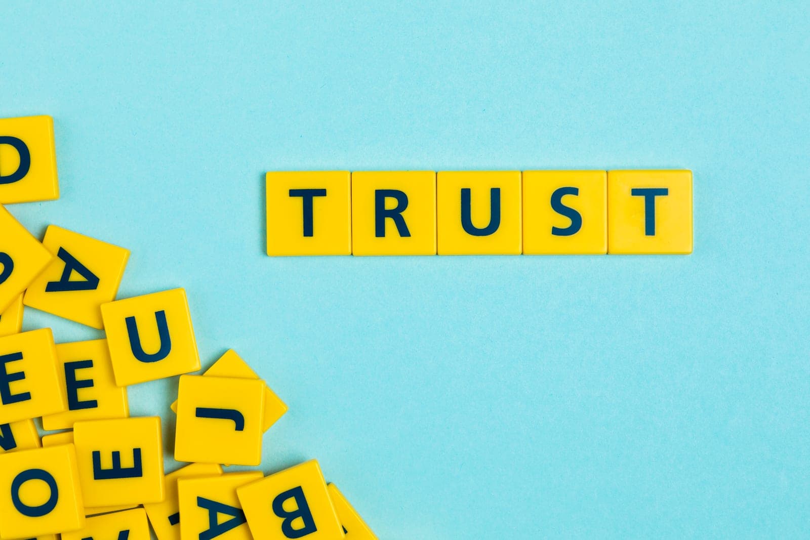 Letter tiles spelling the word "trust"