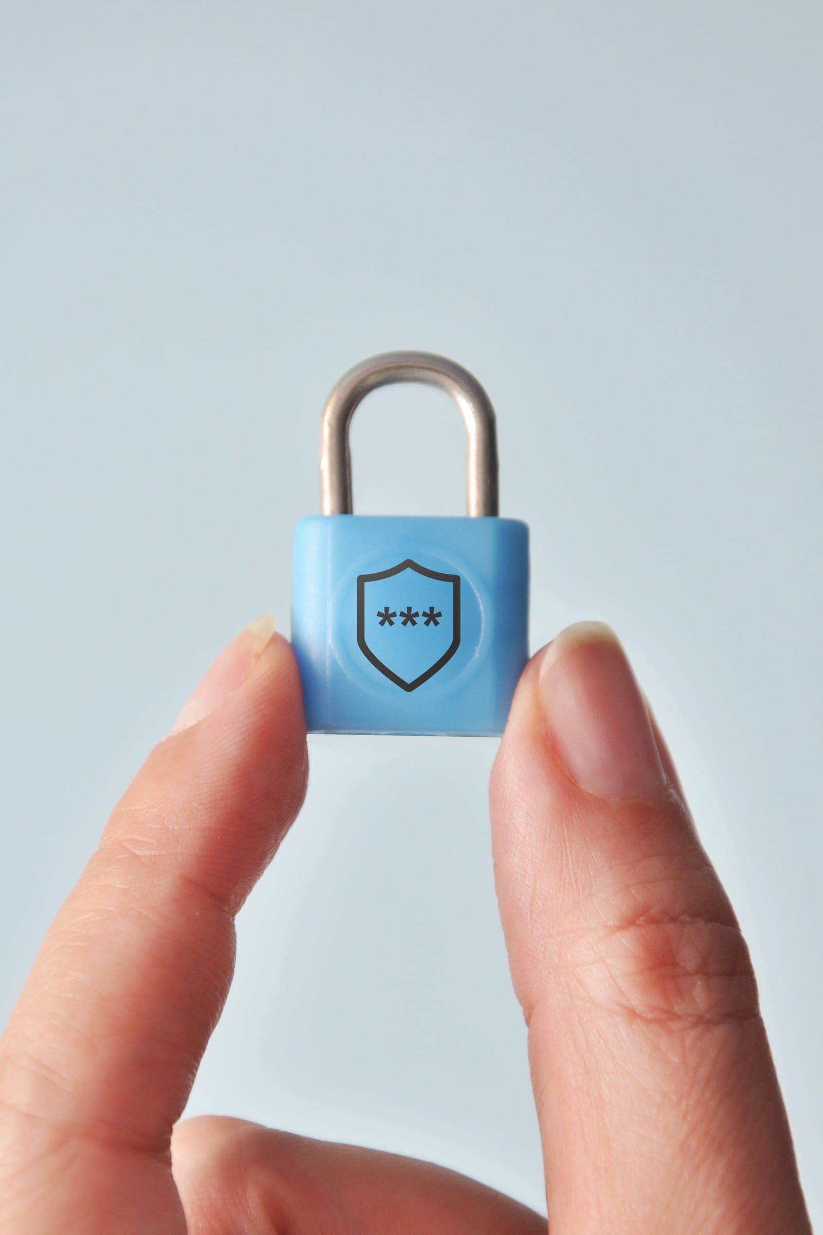 A blue padlock with a shield symbol on a digital background