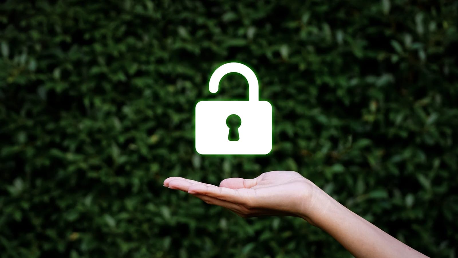 Hands holding a padlock icon over a virtual interface